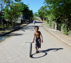 Simple games - a boy, a tire, a stick - Granada,Nicaragua