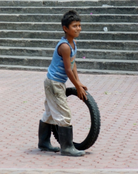 Young boy with a tire - Matagalpa,Nicaragua