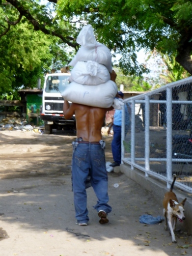 carrying bags of rice or beans,Granada, Nicaragua