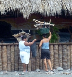 women gathering wood - El Tunco,El Salvador