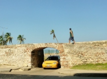 old wall, taxi and pedestrian in Cartagena