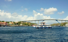 ferry in front of Queen Juliana Bridge