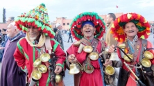 Colorfully dressed Berver vendors. Marrakesh medina plaza, Morocco